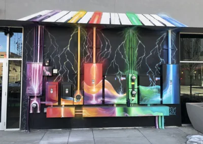 A colorful mural painted on the side of a building.