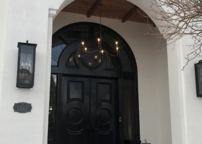 The front door of a house with a black door.